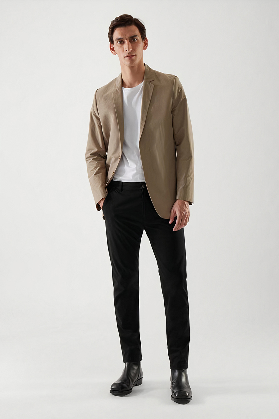 tan blazer, white crew neck t-shirt, black chinos, and black Chelsea boots