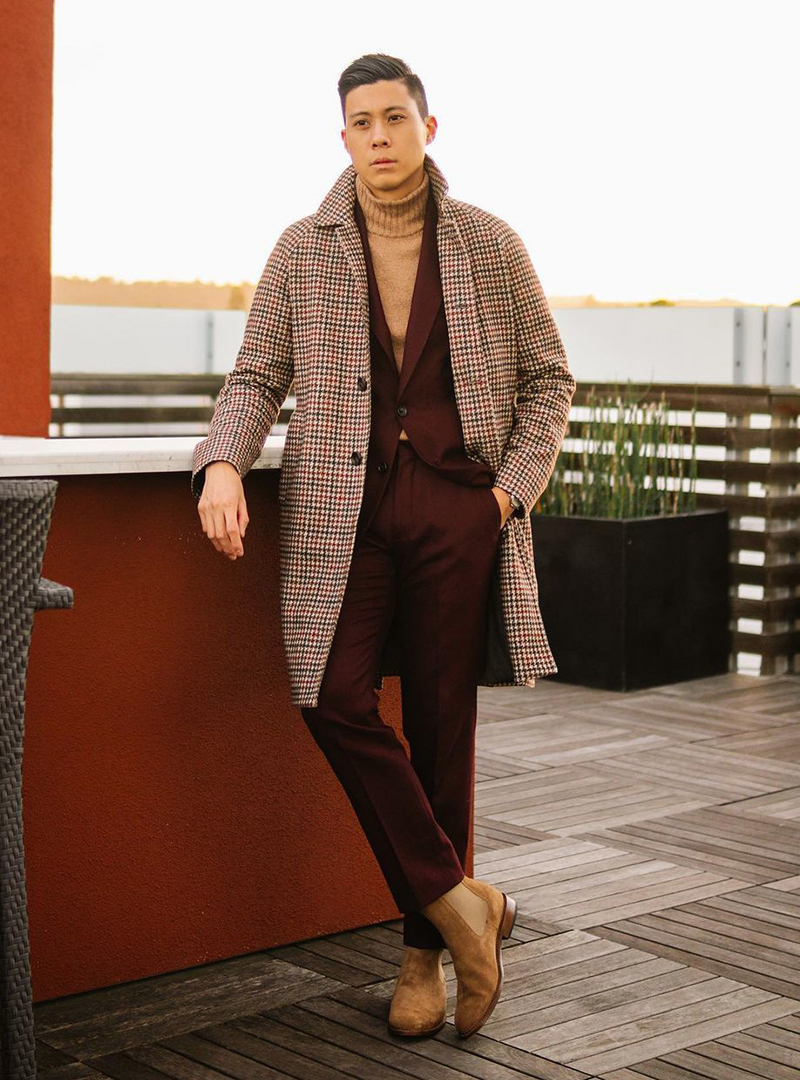 burgundy suit, tan turtleneck, and tan Chelsea boots