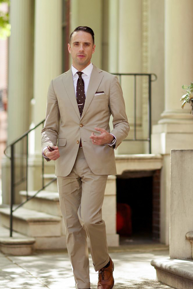 Tan suit, white shirt, and brown tie color combination