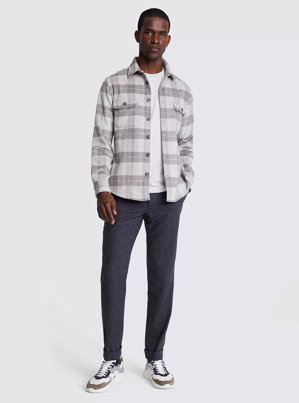 taupe checked flannel shirt, white t-shirt, and charcoal pants