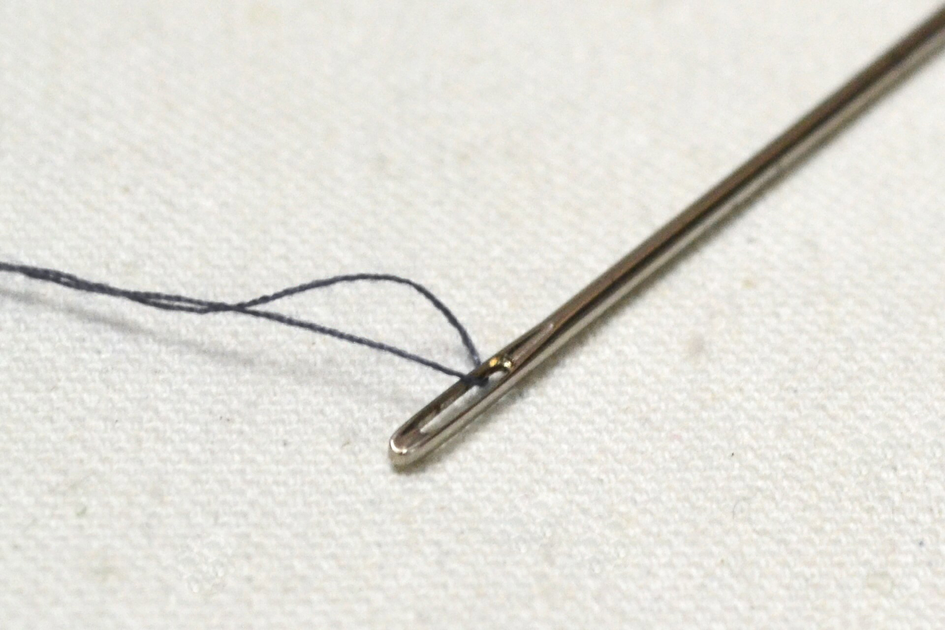 using needle and thread to hem suit pants