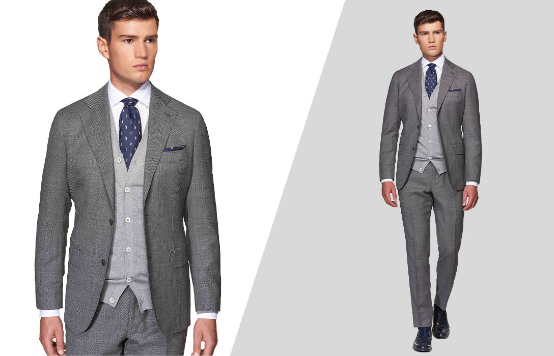 grey suit, white shirt, and grey cardigan sweater