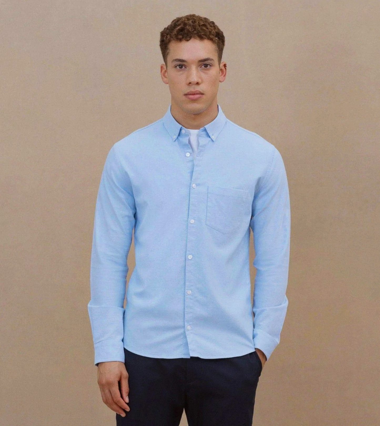 wearing light blue button-down dress shirt on a first date