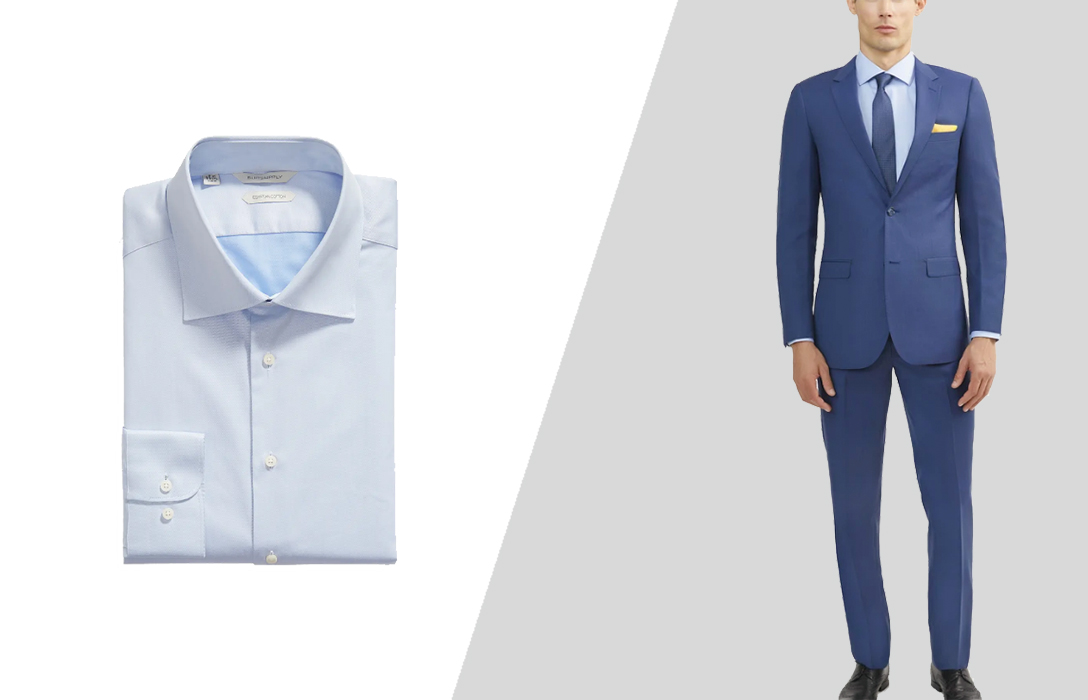 wearing blue suit with a pale blue dress shirt