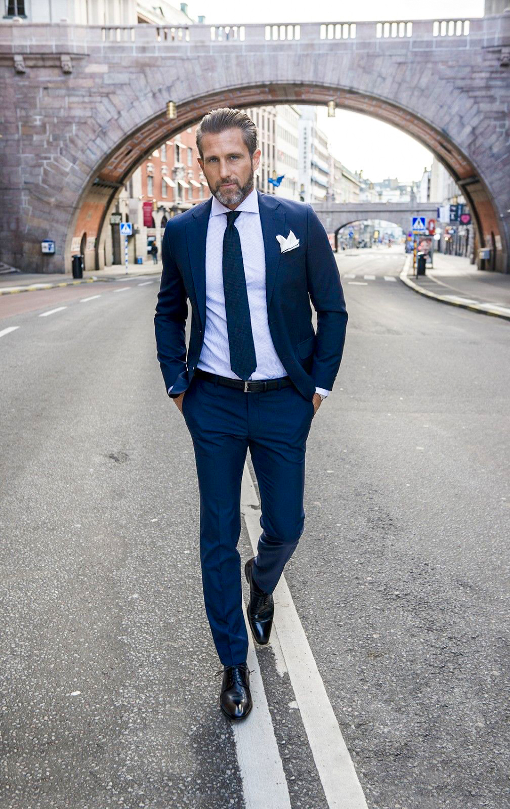 blue wedding suit, white shirt, black derby shoes, and black tie