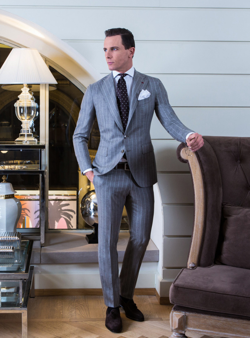 wearing-grey-pinstripe-suit-with-white-dress-shirt-and-brown-tie
