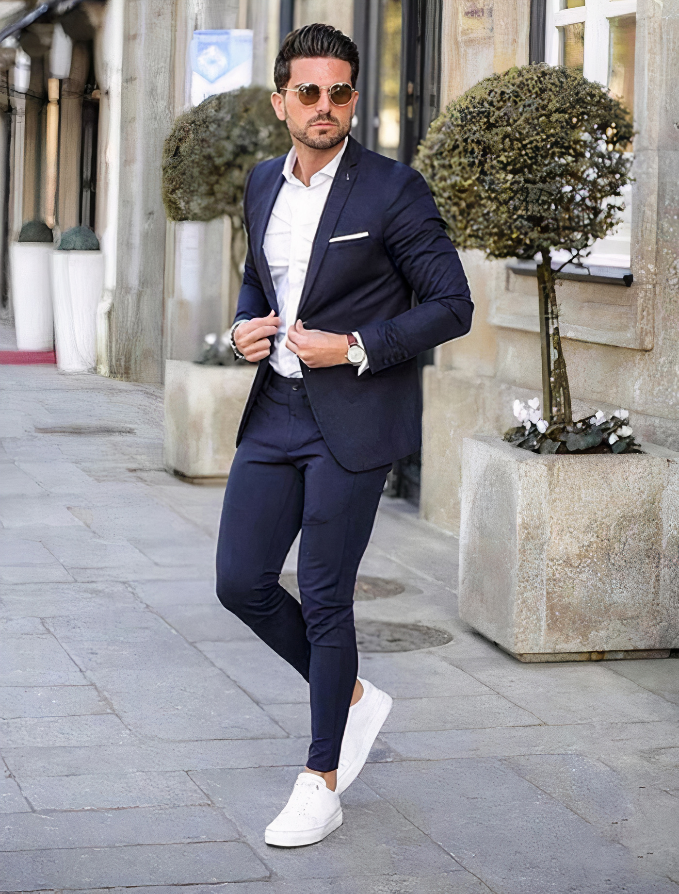 navy suit with white dress shirt and white sneakers