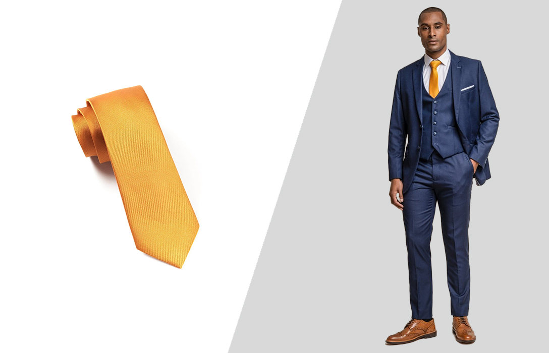 Wearing an orange tie with a navy suit