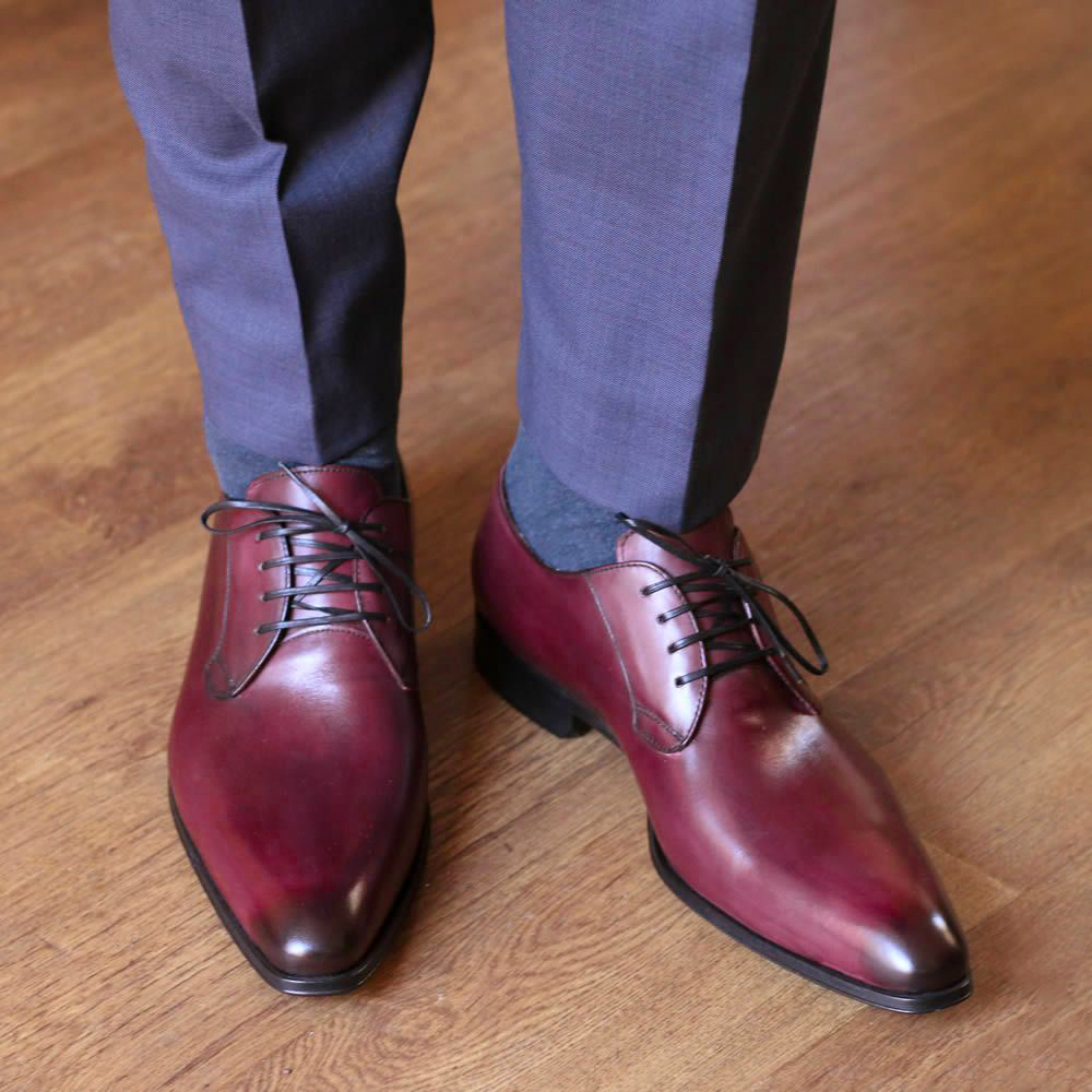 wearing oxblood burgundy shoes with blue pants