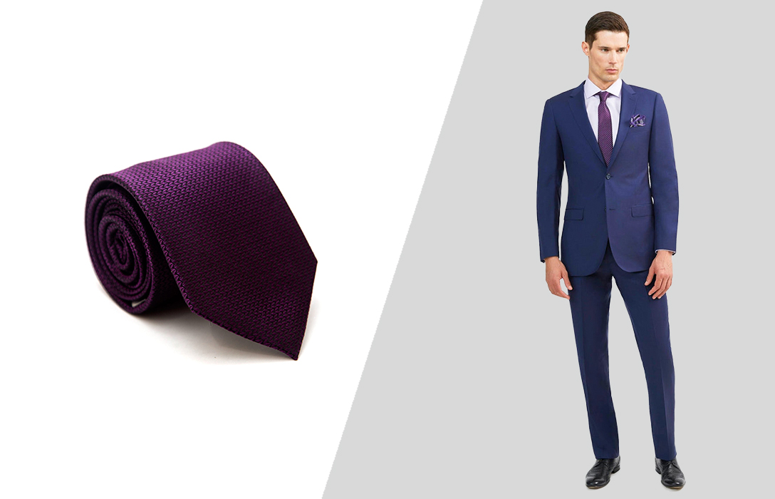 Wearing a purple tie with a navy suit