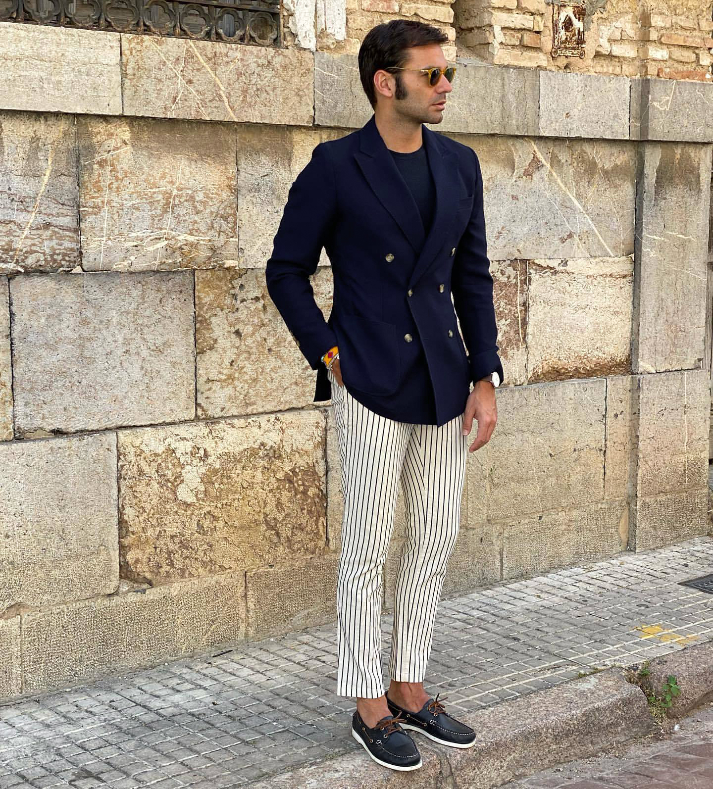 smart-casual attire: navy blazer, navy boat shoes and black-striped chinos