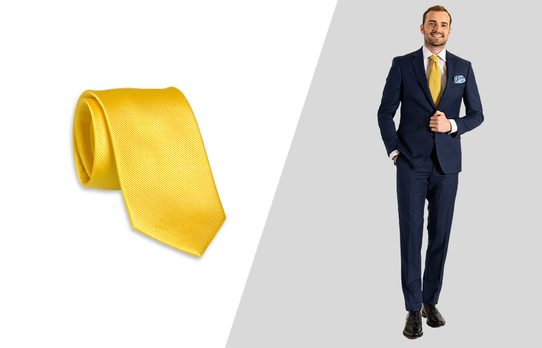 Wearing a yellow tie with a navy suit