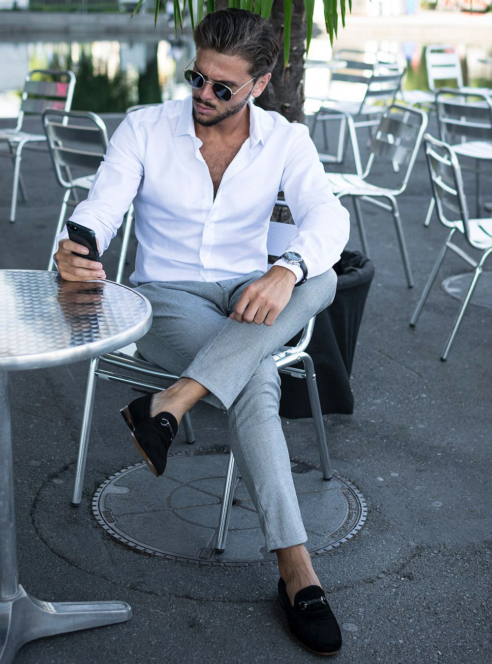 white dress shirt, grey pants, and black loafers