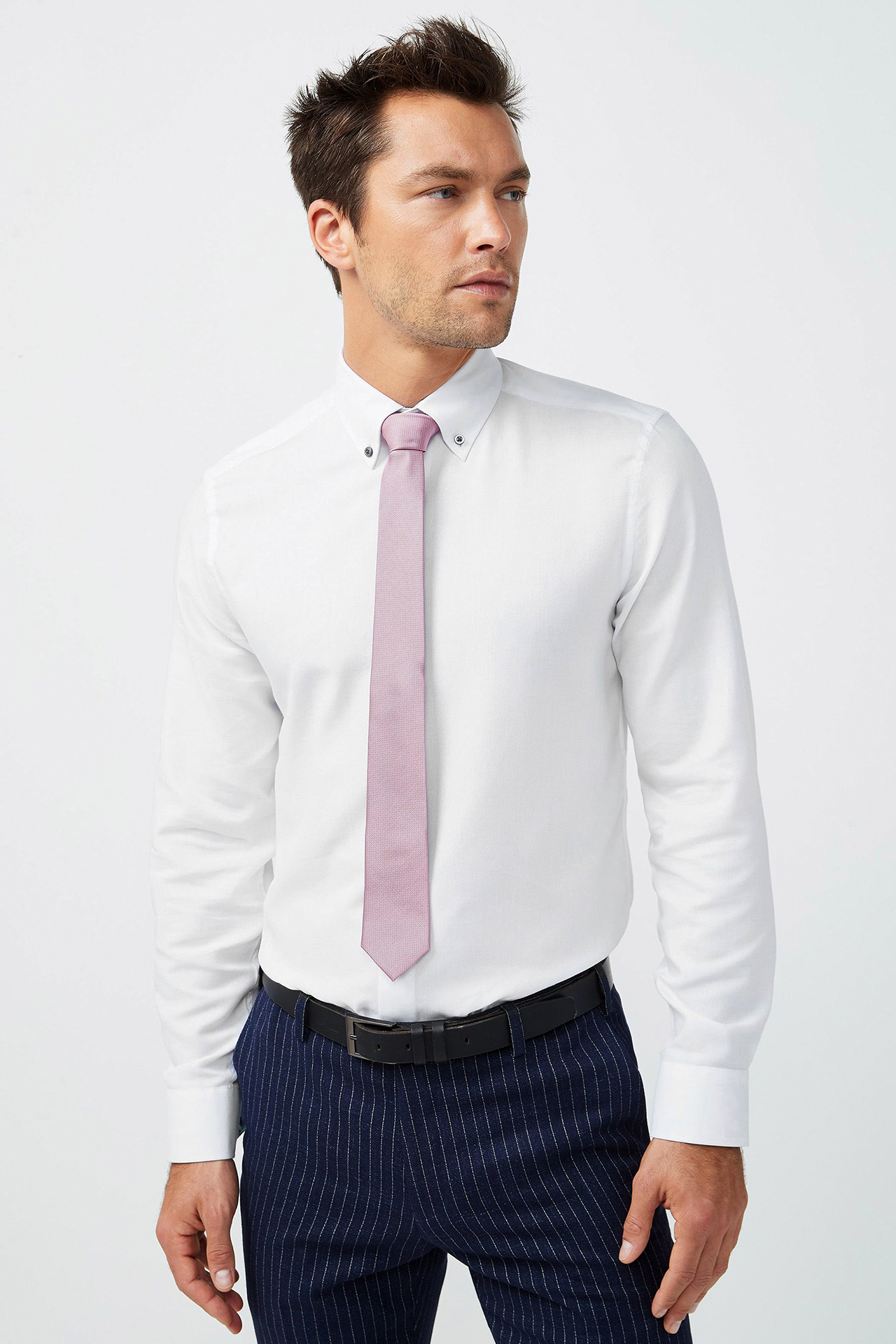 white dress shirt with pink tie and navy striped pants