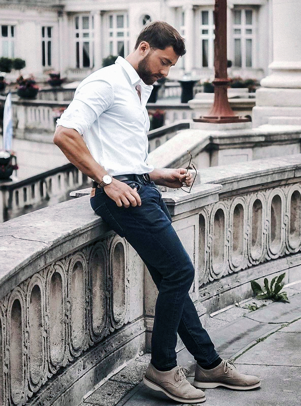 white shirt, navy jeans, and tan derby brogues