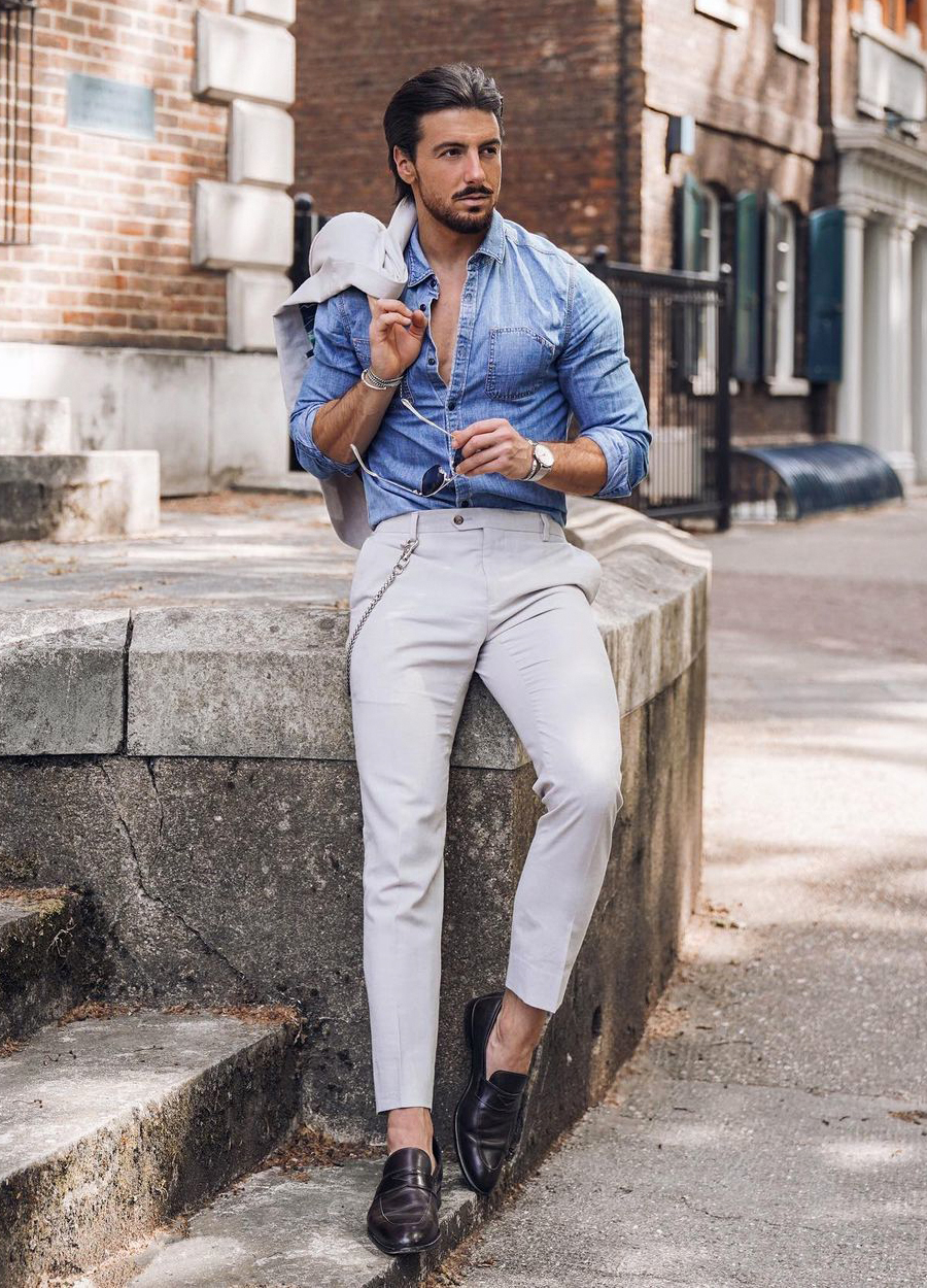 white suit, denim blue shirt, and black loafers