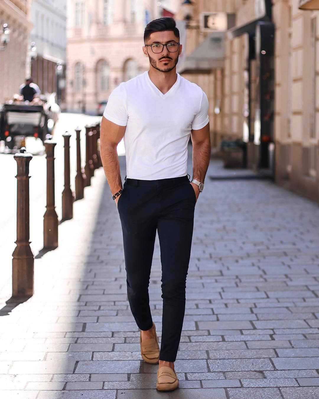 white t-shirt, navy chino pants, and light brown loafers